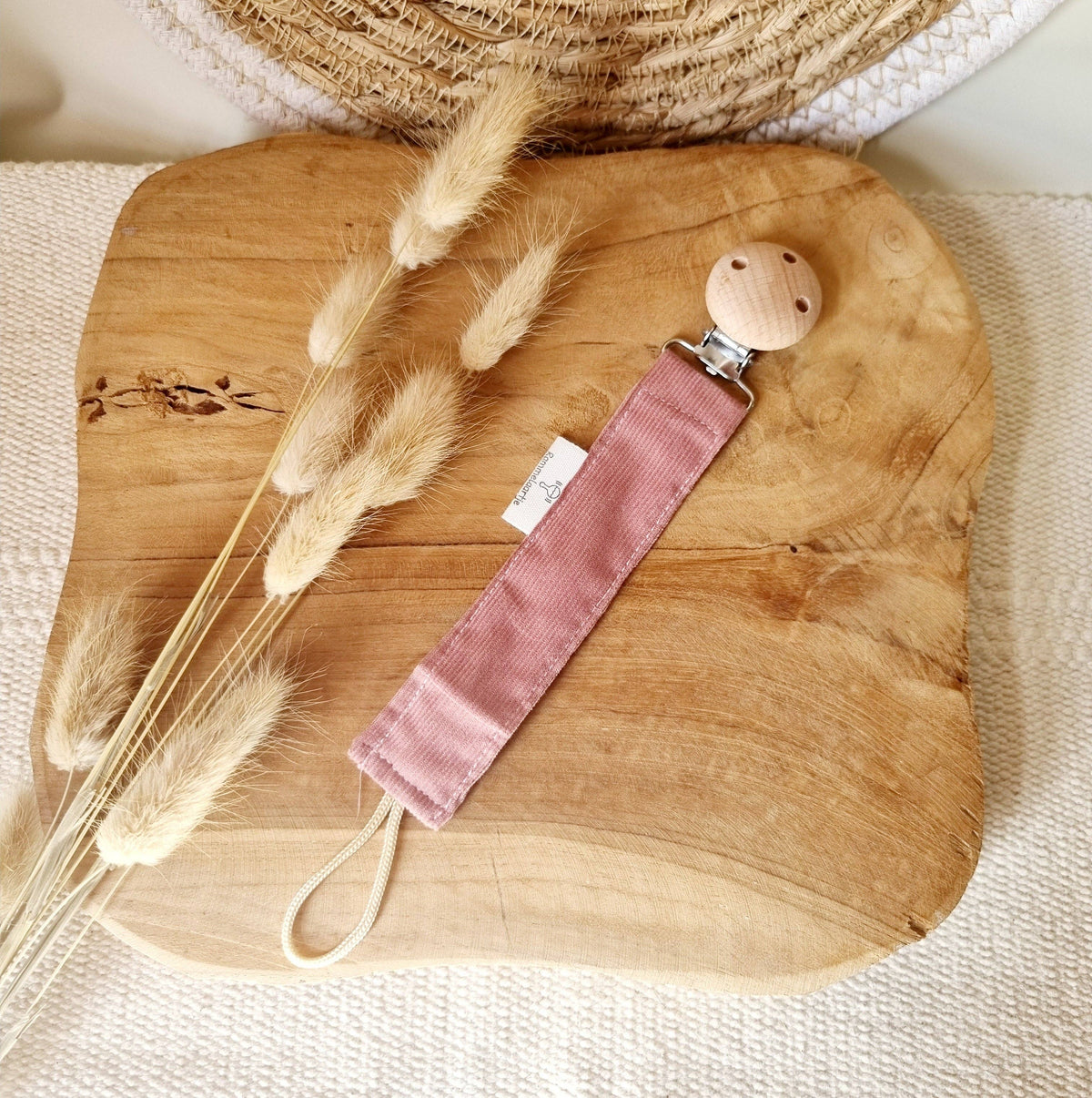 Attache tétine rose poudré en velours côtelé